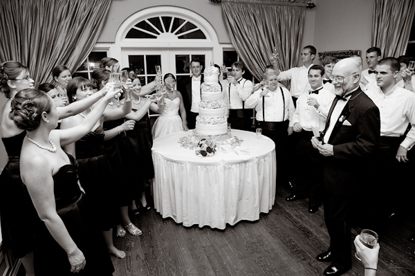 bridesmaids and groomsmen giving a toast - photo by Houston based wedding photographer Adam Nyholt